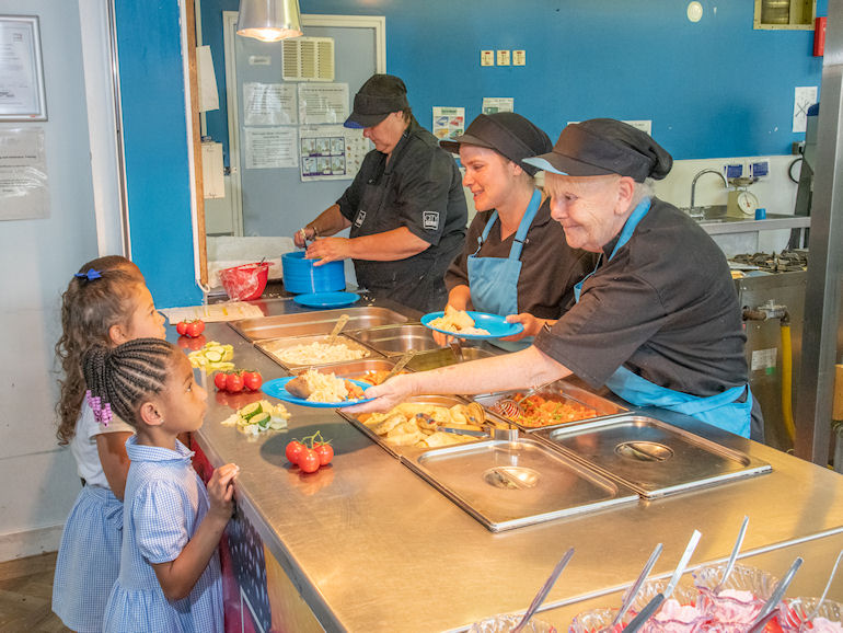 Children choosing healthy meals at lunchtime