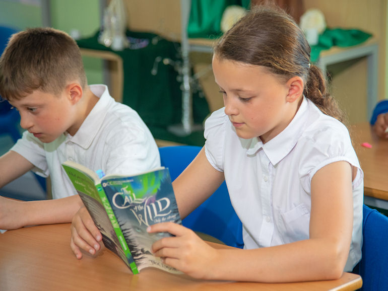 Two pupils engrossed in their reading